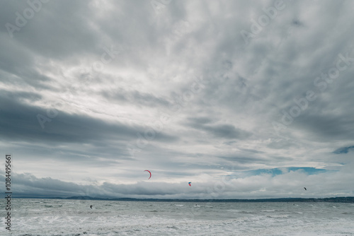 Parasailing in the Puget Sound, Seattle, Washington. Discovery park sports. Parachute and surf board.