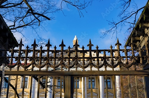 Ancient forged fence against the background of the building