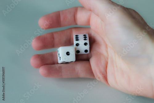 Hand throwing pair of dice game metaphor life unpredictability chance entertainment isolated on white background