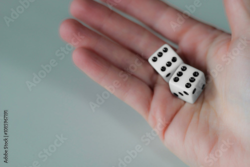 Hand throwing pair of dice game metaphor life unpredictability chance entertainment isolated on white background