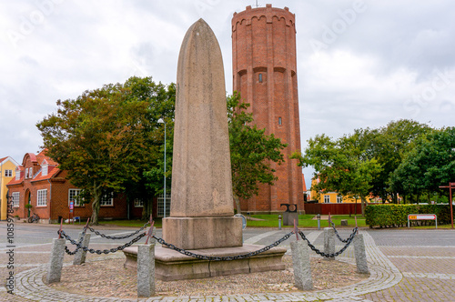 Memorial stone (Mindestøtten). Water tower from 1934 in background (function until 1983). Skagen, Denmark.