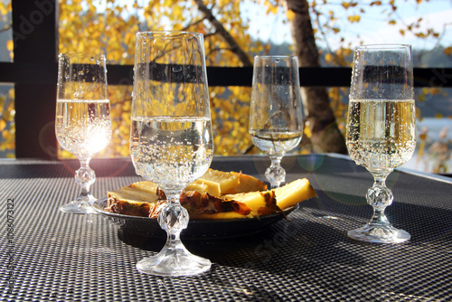 Bridal Shower. Four glasses of champagne with pineapples in nature