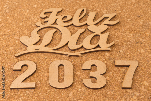 Happy new year 2037 on wooden background