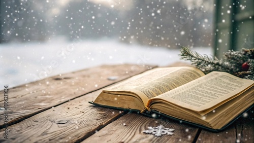 Open Holy Bible on a rustic wooden table with snowflakes