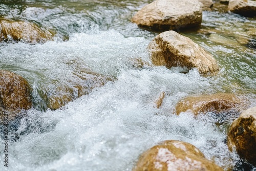 Rushing Water Flowing Over Smooth River Rocks