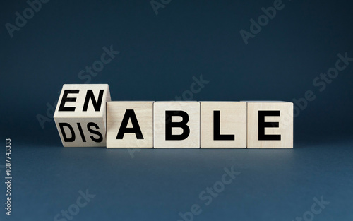 Wooden blocks spelling Enable or Disable