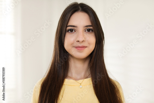 Portrait of beautiful teenage girl at home