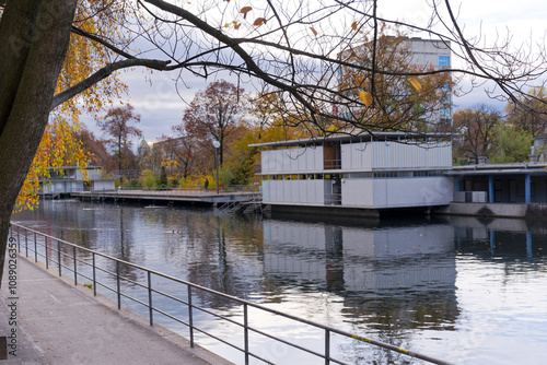 Scenic view of Limmat river with autumn trees and river bath upper Letten on an autumn day at Swiss City of Zürich. Photo taken November 18th, 2024, Zurich, Switzerland.