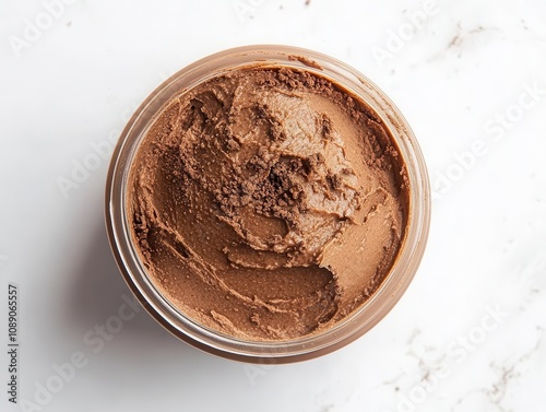 rich chocolate cream spread artistically displayed on a white surface, viewed from above, highlighting its texture and indulgent appeal for dessert lovers