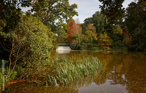 Fast running water over the weir at Sheffield Park in Uckfield East Sussex England UK