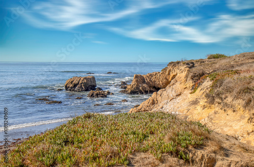 View of bluffs overlooking the Pacific Ocean in daytime, blue sky, soft clouds, nobody