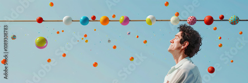 A man balances a long, thin pole vertically on his chin, a line of colorful balls perched atop it, while simultaneously juggling two more balls.