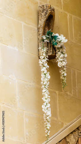 Elegant White Flowers Cascading from Rustic Wooden Holder