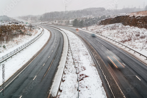 Long exposure motion blur of traffic on the A465 at Ebbw Vale during a winter snow storm