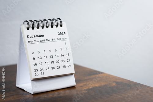 December 2024 calendar on the wooden table. Month page