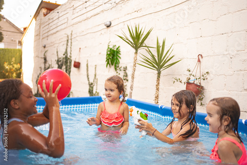 Four kids splash and play together in a vibrant outdoor pool