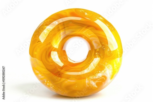 A vibrant yellow gemstone, possibly amber, carved into a donut shape, showcasing its translucent beauty and internal patterns.