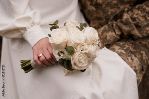 Elegant Bridal Bouquet in a Serene Military Setting