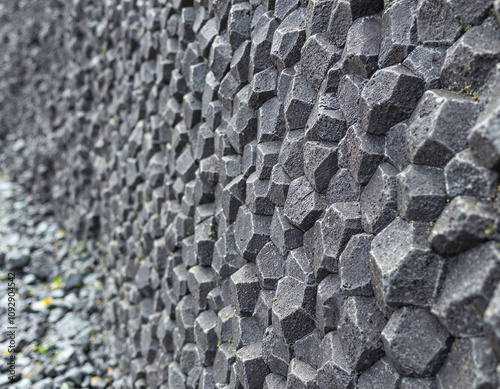 Close-up view of natural hexagonal basalt columns, showcasing iceland's unique geology.