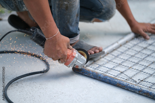 Using a Abrasive Cutoff Machine or chop saw on the floor to cut a piece.