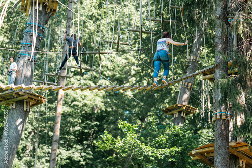 Experience a thrilling treetop adventure where participants navigate ropes, bridges, and daring challenges