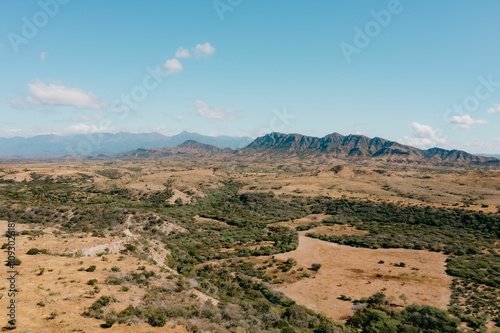 Desert landscape with distant mountains.