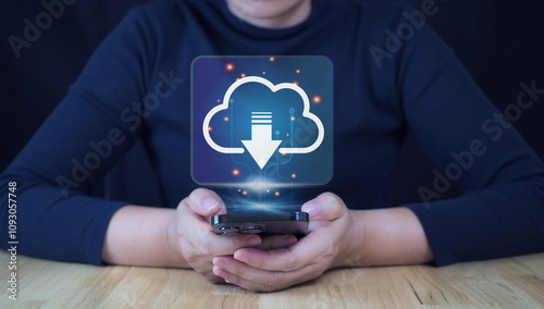 Download Technology for Data Storage and Transfer. A person holds smartphone with glowing download icon, symbolizing digital data storage, cloud services,