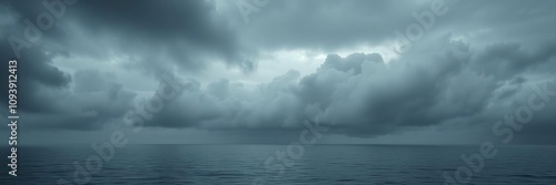 Vague greyish-black clouds suspended in the middle of a calm ocean, atmosphere, undefined, misty