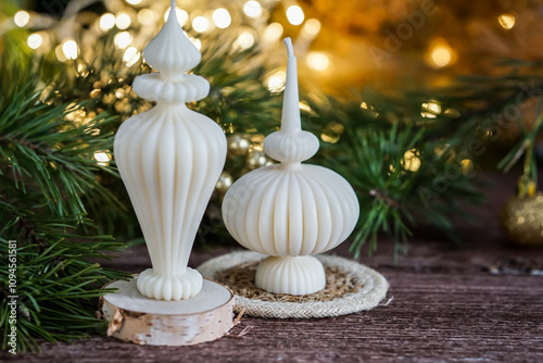 Ribbed Eco-friendly candles made from soy and olive oil wax, surrounded by pine branches and festive lights.