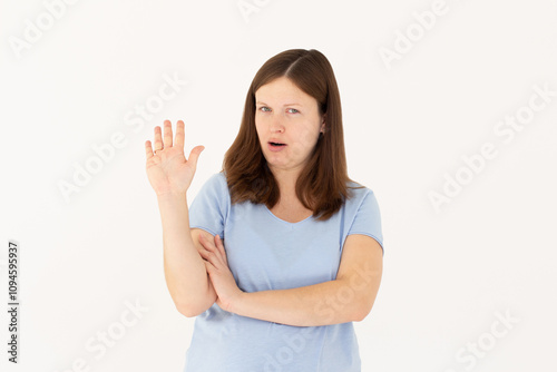 Portrait of young woman making stop sign in front of the camera.