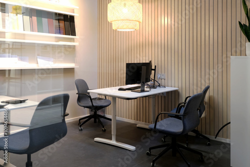 A Modern Office Space Featuring Ergonomic Furniture and Stylish, Contemporary Lighting Options