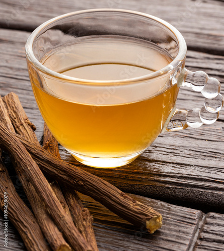 Glycyrrhiza glabra - Hot drink made from dried liquorice stems in a cup.