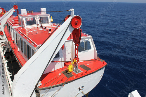 Lifeboat Number 13 on a cruise ship at sea 