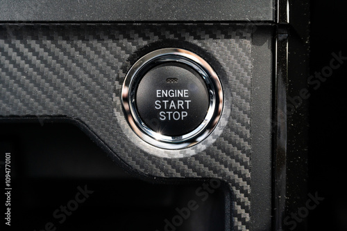 Close-up view of the engine start stop button in the car.