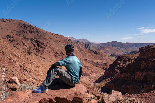 Cyclist Resting and Looking at the Landscape of the Atlas Mountains