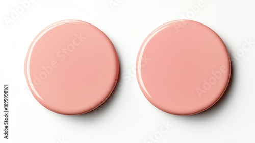 Two glossy pink circular objects arranged symmetrically on a white background, ideal for design and marketing projects.