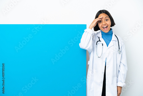 Young mixed race doctor woman with a big placard isolated on white background has realized something and intending the solution