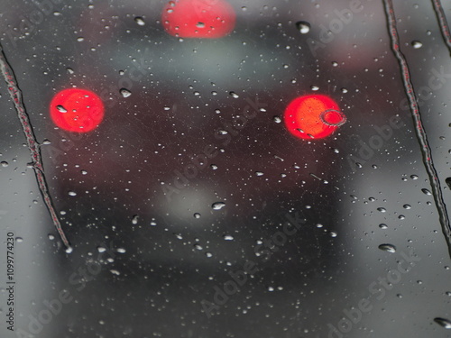 heavy rain slow motion on car window while driving