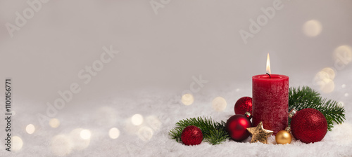 Christmas Background - Red Candle in winter snow landscape background - Blank greeting card with magic golden bokeh lights with copy space for your Xmas Advent greeting card or advertisement, Panorama