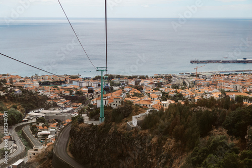 Cable car with cabins above the city Funchal, Madeira Island, Portugal