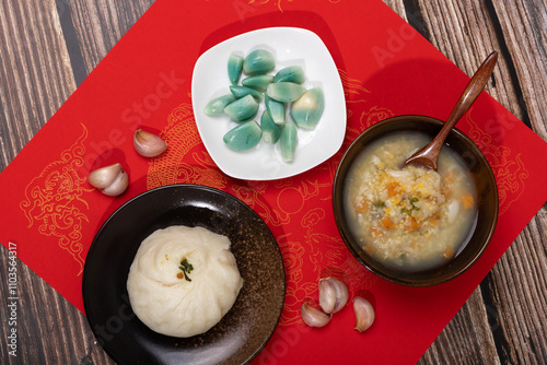 Laba garlic and steamed stuffed bun with sweet potato lily golden rice porridge