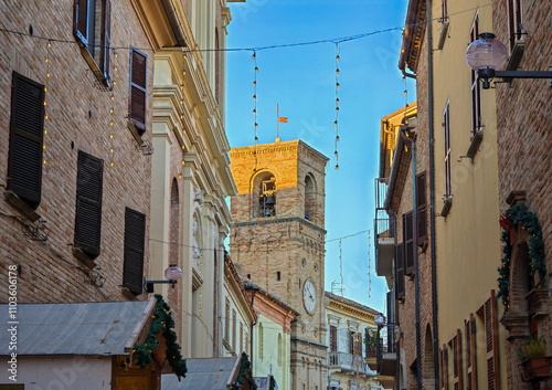 View of the old street of Mombaroccio village with traditional christmas market in the Marche region hills, Italy