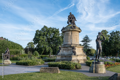 View of the Gower Memorial in Stratford-upon-Avon, England. This iconic monument features Shakespeare's statue surrounded by characters from his plays, celebrating the playwright in his birthplace.