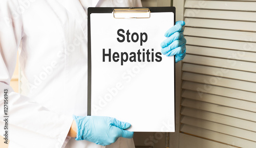 STOP HEPATITIS Portrait of a doctor writing a prescription