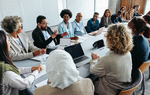 Multiethnic group of businesspeople brainstorming and strategizing in a meeting