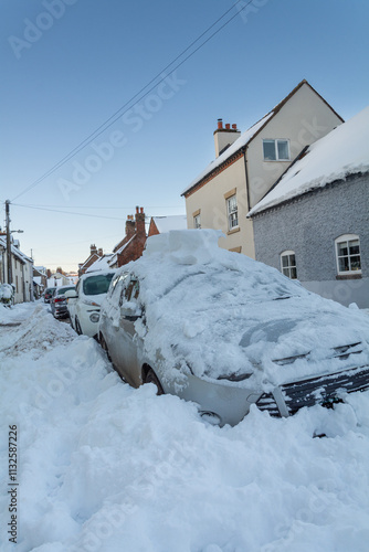 Shropshire, UK, 11-12-2017. Cars are snowed under in the aftermath of Storm Caroline.