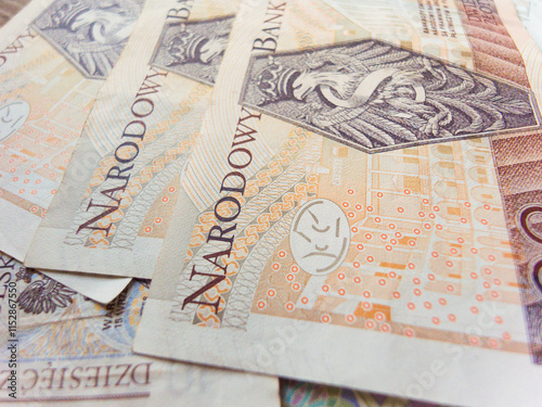 A stack of banknotes with the word Narodowy written on them